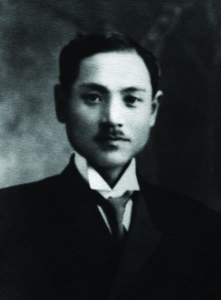 A portrait of Reverend Tsunesuke Hayashi as a young man in a dark suit