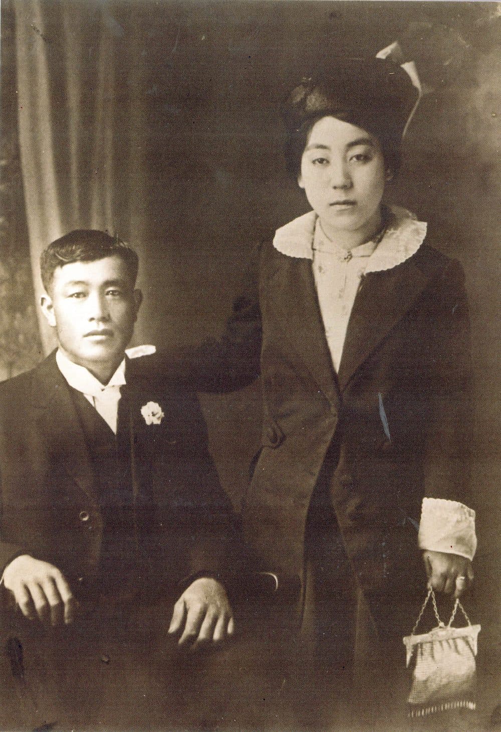 A formal portrait of Juichi Nawa, seated, and Sakaye Nawa, standing beside him