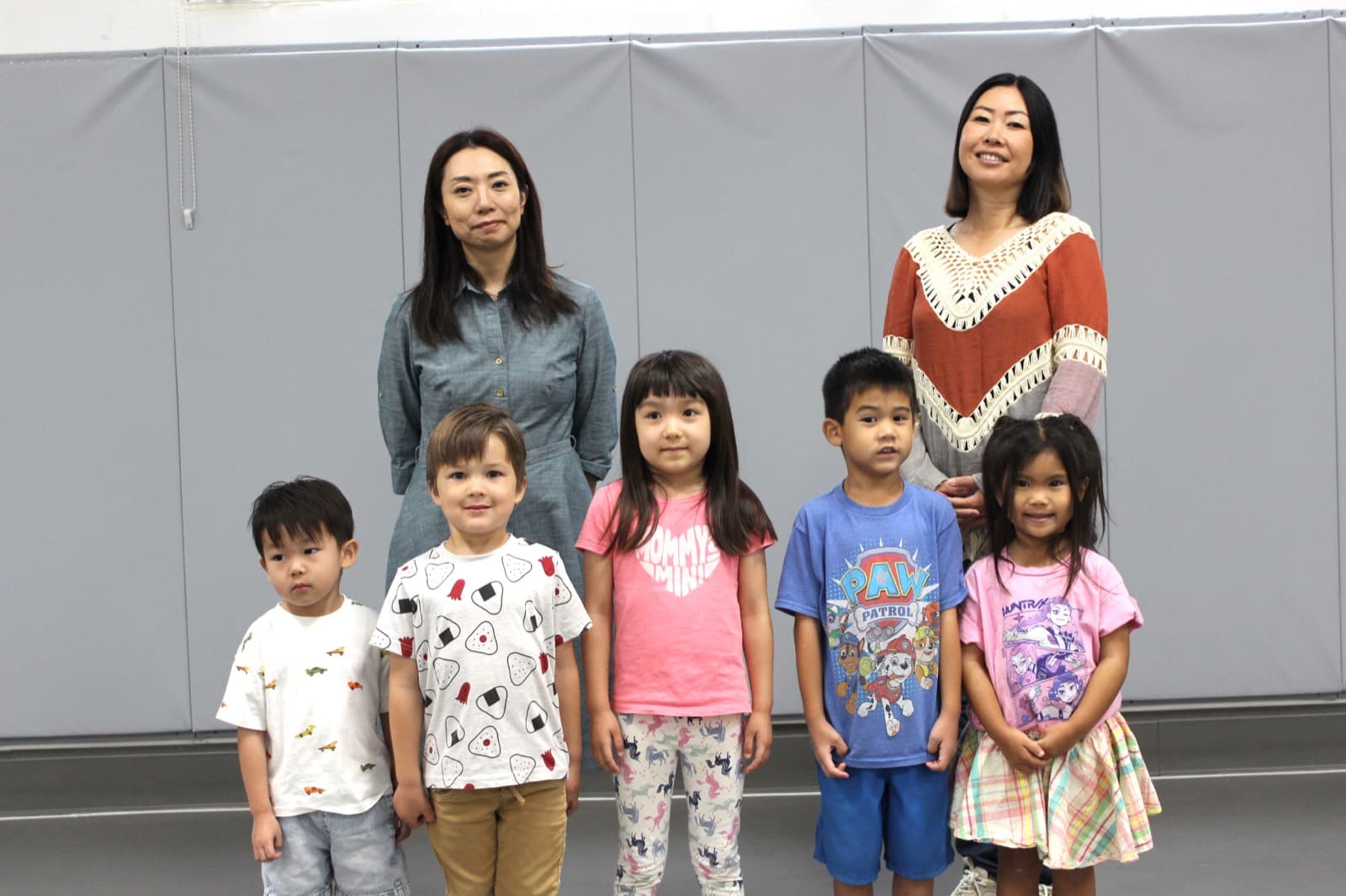 Kindergarten students with their two teachers in the hall